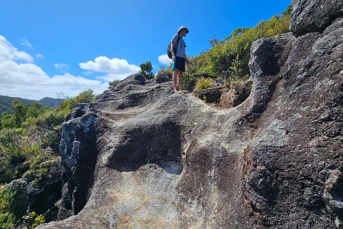 Alan on steep rock scramble near Maungapiko summit Great Barrier Island